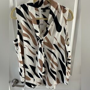Animal print, polyester blouse size large